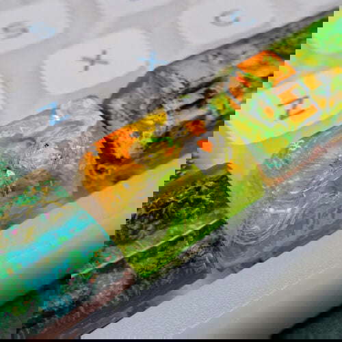 Colorful artisan keycaps on mechanical keyboard.